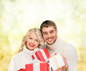 Image showing smiling woman and man with gift box