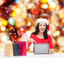 Image showing woman in santa helper hat with tablet pc