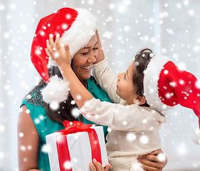 Image showing happy mother and child girl with gift box