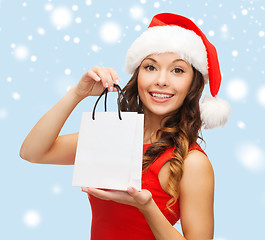 Image showing woman in red dress with shopping bag