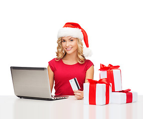 Image showing woman with gifts, laptop computer and credit card