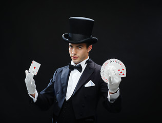 Image showing magician showing trick with playing cards