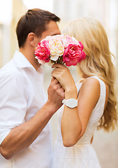 Image showing couple with flowers in the city