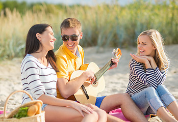 Image showing group of friends having fun on the beach