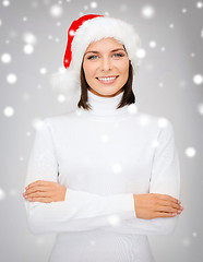 Image showing smiling woman in santa helper hat