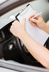 Image showing man with car documents