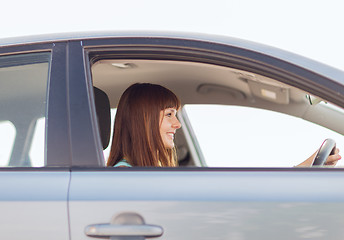 Image showing happy woman driving a car