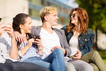 Image showing students looking at smartphones and tablet pc