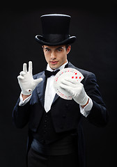 Image showing magician showing trick with playing cards