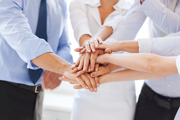 Image showing business team celebrating victory in office