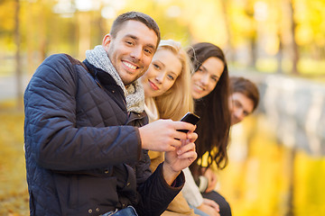 Image showing group of friends having fun in autumn park