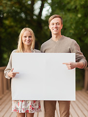 Image showing romantic couple with blank white board