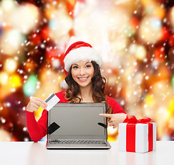 Image showing woman with gift, laptop computer and credit card