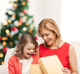 Image showing happy mother and child girl with gift box