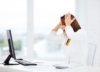 Image showing stressed woman with computer