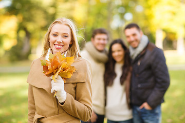 Image showing group of friends having fun in autumn park