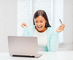 Image showing businesswoman with laptop and credit card