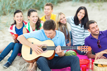 Image showing group of friends having fun on the beach