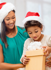 Image showing happy mother and child girl with gift box