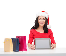 Image showing woman in santa helper hat with tablet pc