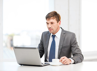 Image showing businessman working with laptop computer