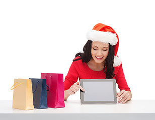 Image showing woman in santa helper hat with tablet pc