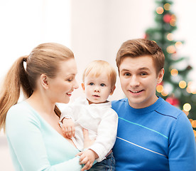 Image showing happy parents playing with adorable baby