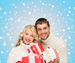 Image showing smiling woman and man with gift box