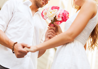 Image showing couple with flowers in the city