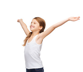 Image showing smiling teenage girl with raised hands