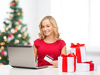 Image showing woman with gifts, laptop computer and credit card