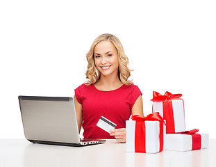 Image showing woman with gifts, laptop computer and credit card