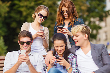 Image showing students looking at smartphones and tablet pc