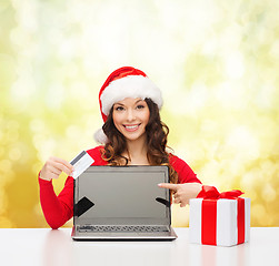 Image showing woman with gift, laptop computer and credit card
