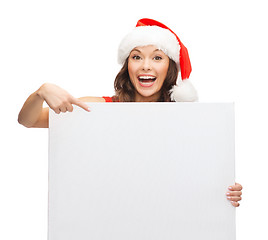 Image showing woman in santa helper hat with blank white board