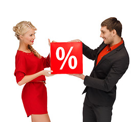 Image showing woman and man with red percent sale sign