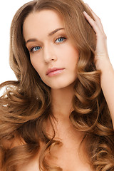 Image showing beautiful calm woman with long curly hair