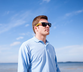 Image showing man in sunglasses on the beach