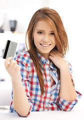 Image showing happy teenage girl with credit card