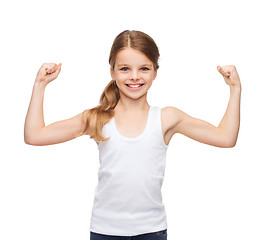 Image showing teenage girl in blank white shirt showing muscles