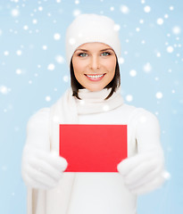 Image showing woman in winter clothes with blank red card