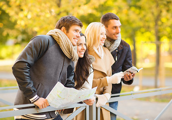 Image showing couples with tourist map in autumn park