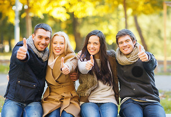 Image showing group of friends having fun in autumn park