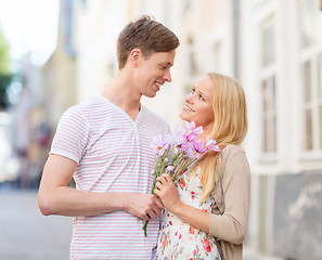 Image showing couple with flowers in the city