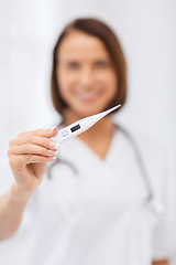 Image showing doctor with thermometer and stethoscope