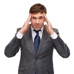 Image showing stressed buisnessman or teacher having headache