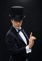 Image showing magician in top hat showing trick