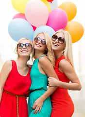 Image showing beautiful girls with colorful balloons in the city