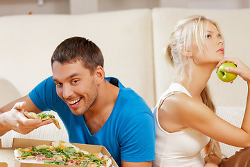 Image showing couple eating different food