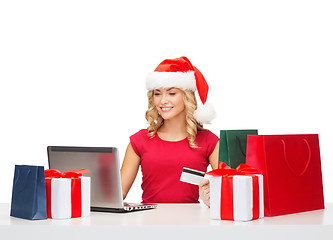 Image showing woman with gifts, laptop computer and credit card